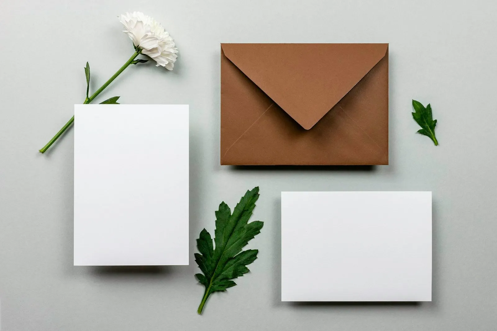 Brown envelope beside white paper