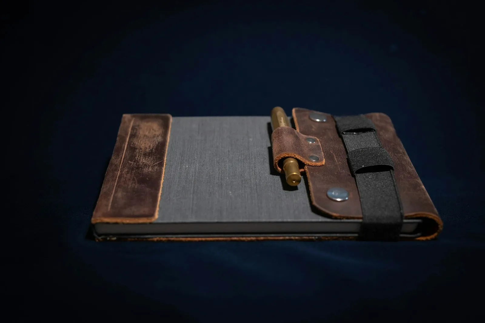 Rustic leather notebook with a pen