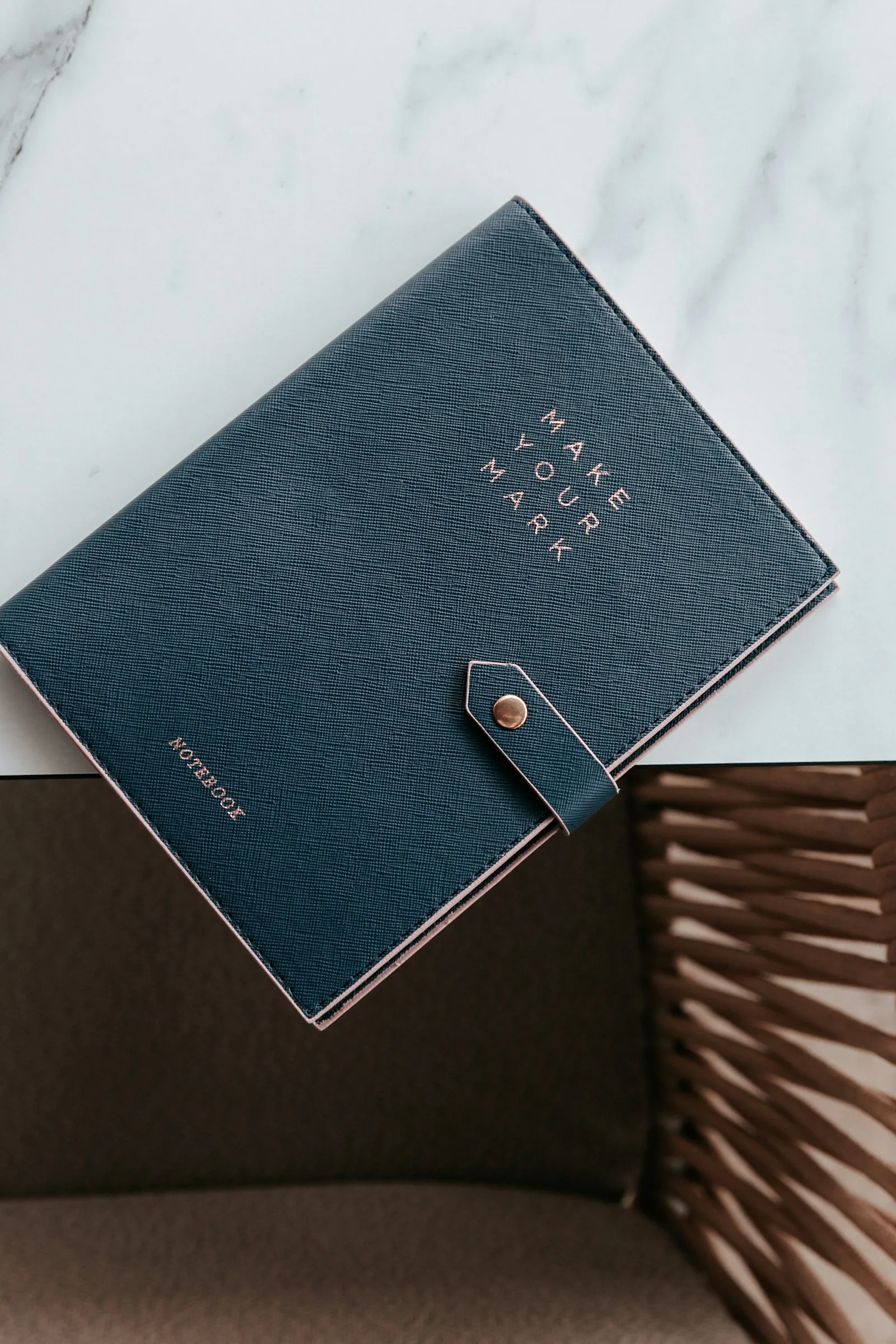 A black and blue notebook on a table