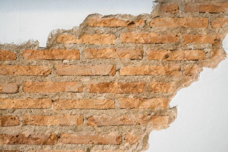 Exposed Brick Under Plaster