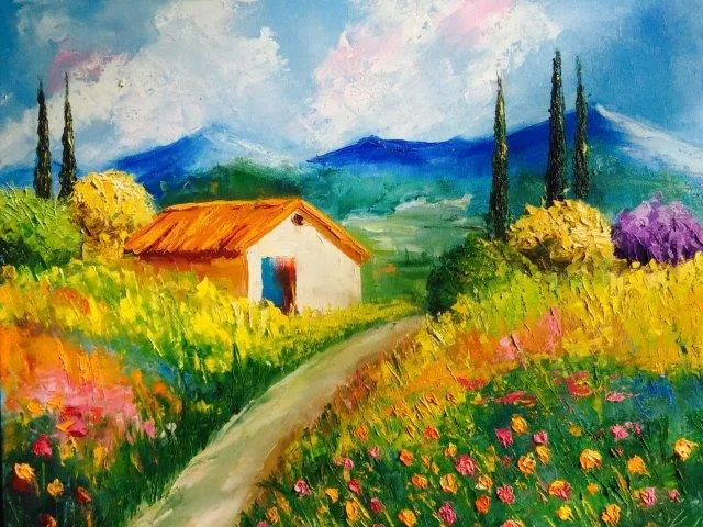 A painted Tuscan cottage with a flower-lined path, cypress trees and blue mountains beyond