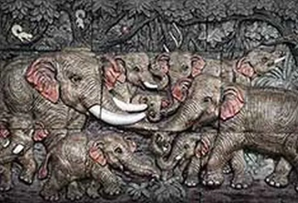 A crowded herd of grey elephants with pink-flushed ears and ivory tusks, in a textured stone relief