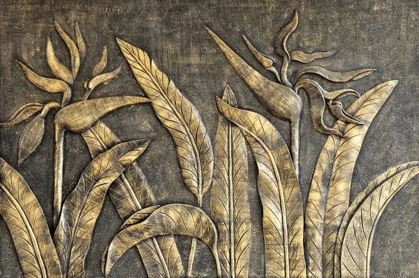 Tall bird-of-paradise blooms and sweeping leaves in burnished gold against a dark charcoal ground