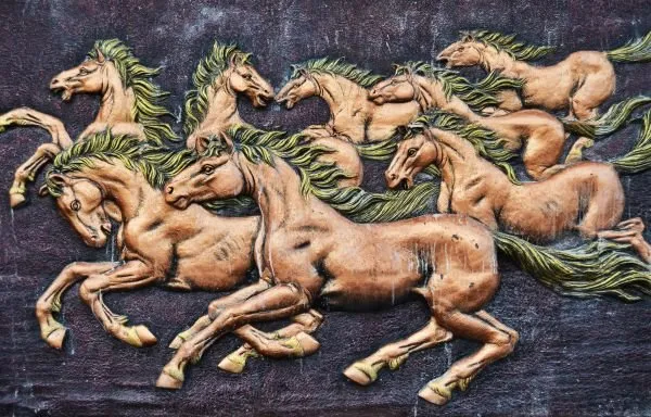 Copper-toned horses with green-tinged manes gallop across a deep indigo-violet relief