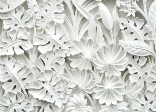 Monstera leaves, ferns and daisy-like flowers layered in a pure white sculpted relief