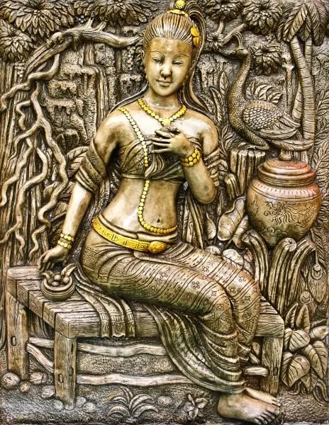 A jewelled maiden sits beside a water pot as a peacock watches from the trees, in silver and bronze relief