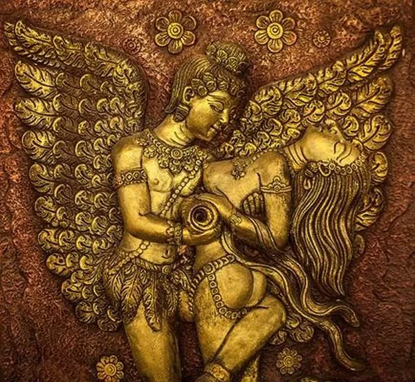 A winged couple embrace beneath great feathered wings, in burnished gold on a copper ground