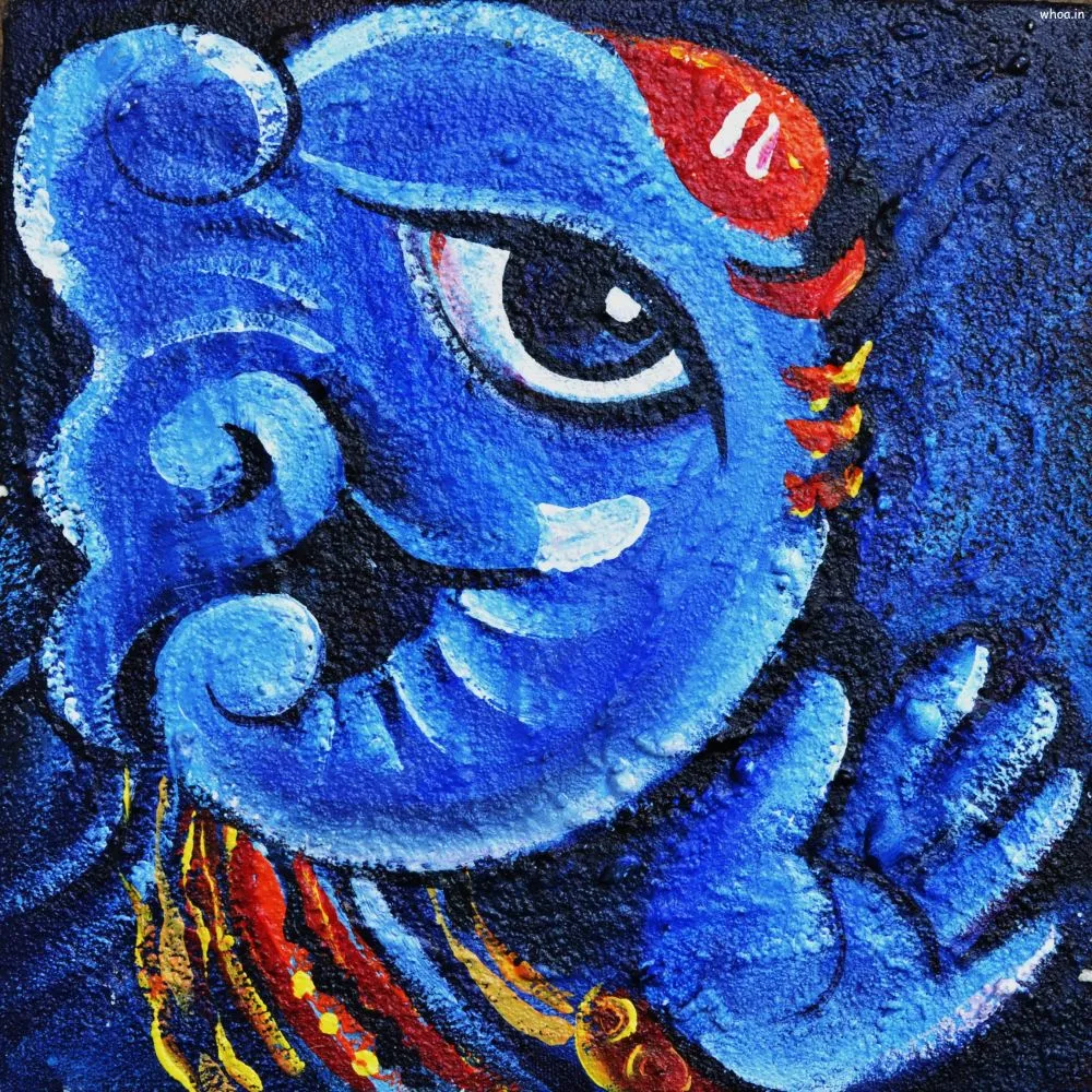 A textured, close-up blue Ganesha face with a large expressive eye and a red tilak