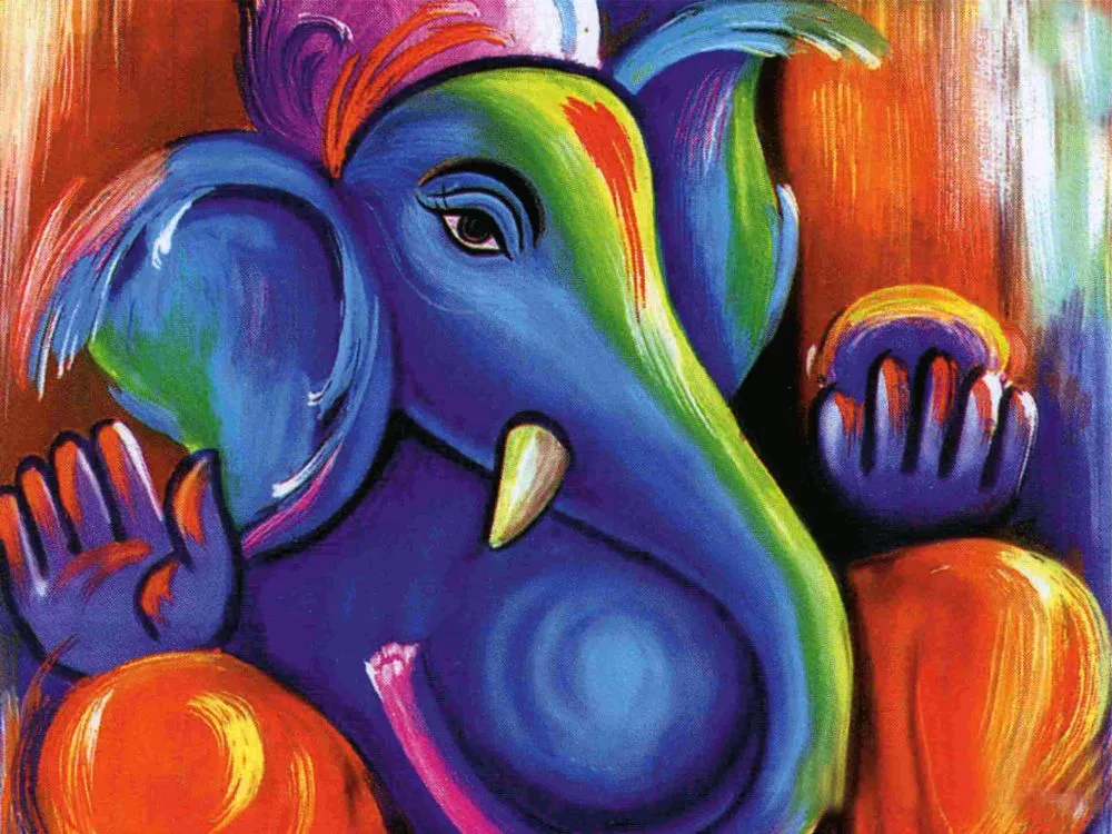 A vivid blue Ganesha face streaked with rainbow colour, holding a modak against a warm orange ground