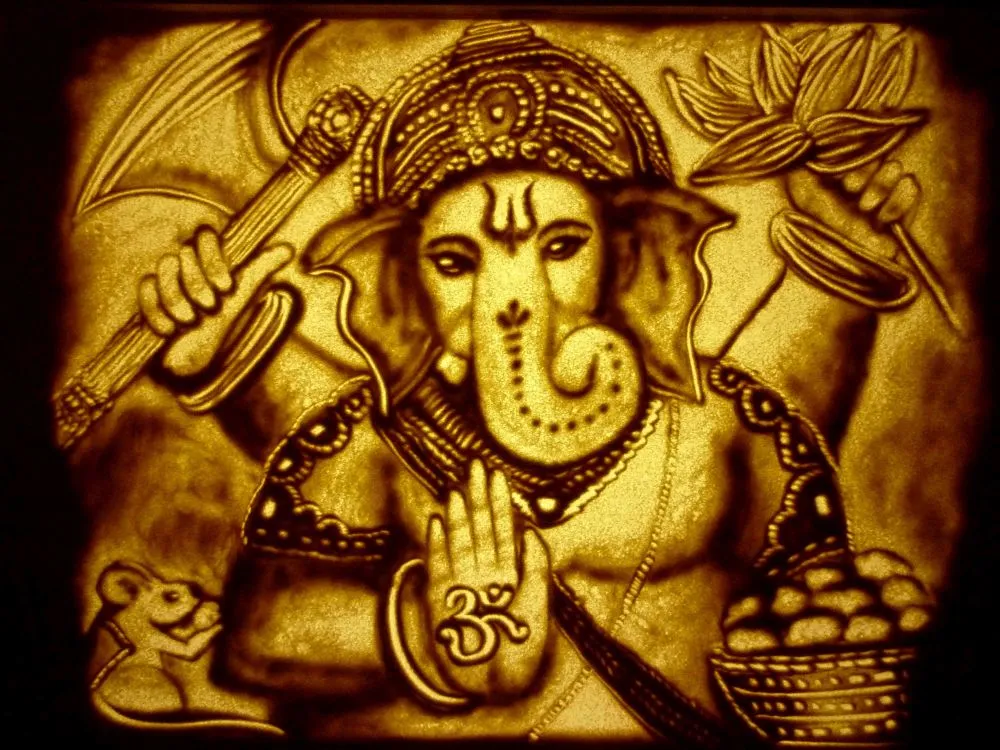 A golden, sepia-toned Ganesha in a carved-relief style, holding an axe and lotus with Om on his palm