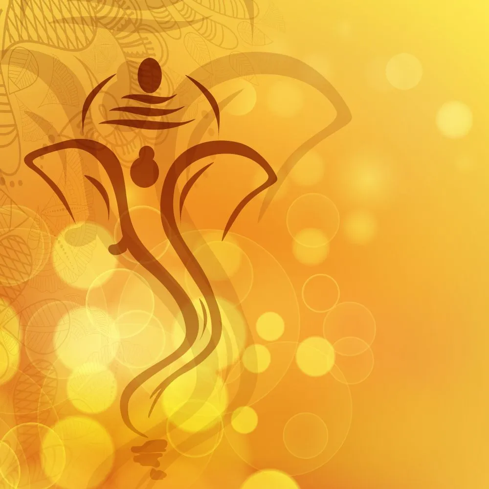A minimal brown line drawing of Ganesha over a warm golden background of soft bokeh light
