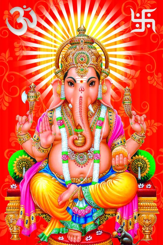 A richly adorned seated Ganesha set against a blazing red background with golden sunburst rays