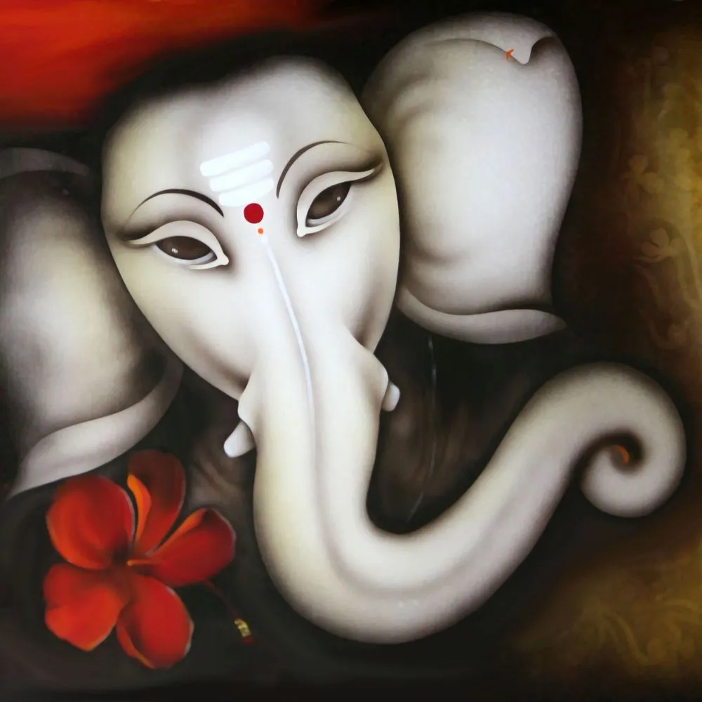 A softly modelled ivory-white Ganesha face with a red tilak and a single red hibiscus