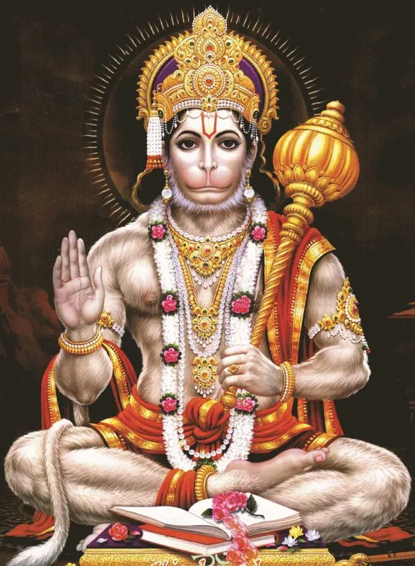 Hanuman seated cross-legged with his golden mace, one hand raised in blessing, against a dark halo