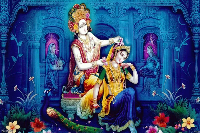 Krishna tenderly adorning Radha's hair inside a carved blue palace, with flowers at their feet
