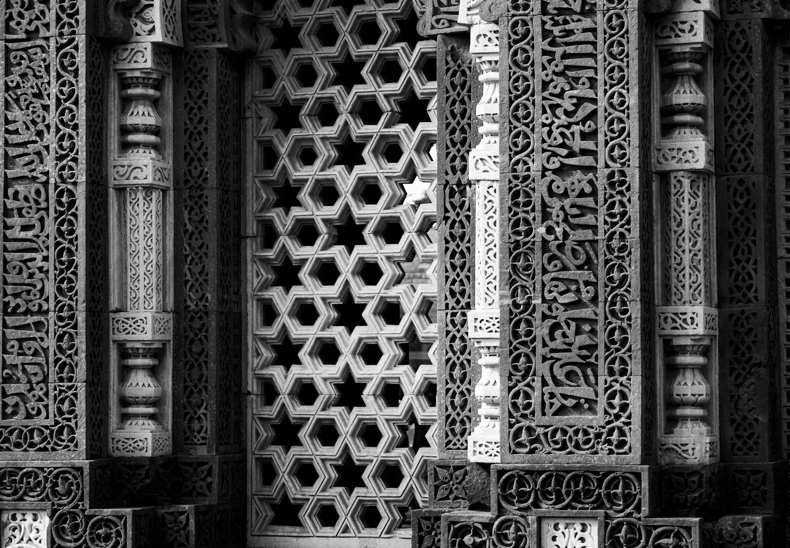 Intricate carved stone jali lattice panel