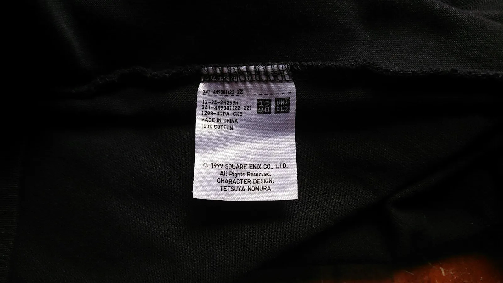 A clothing tag with care instructions