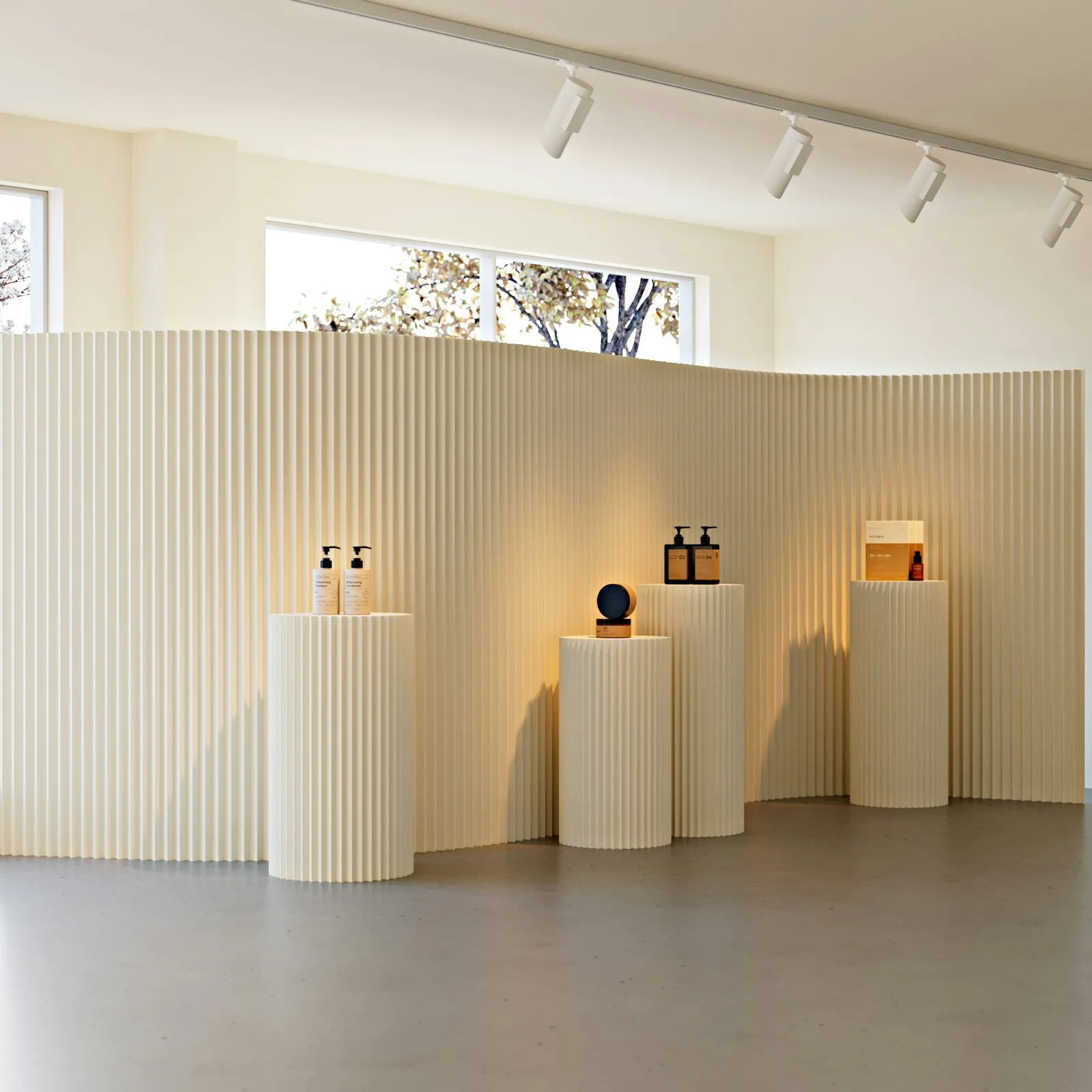 Cream-colored retail display stands in a minimalist store