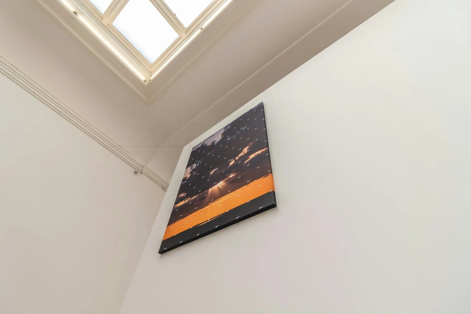 A picture hanging on the wall of a room